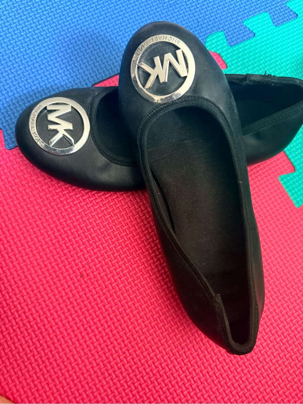 MICHAEL Michael Kors Black Ballet Flats with Silver MK Medallions